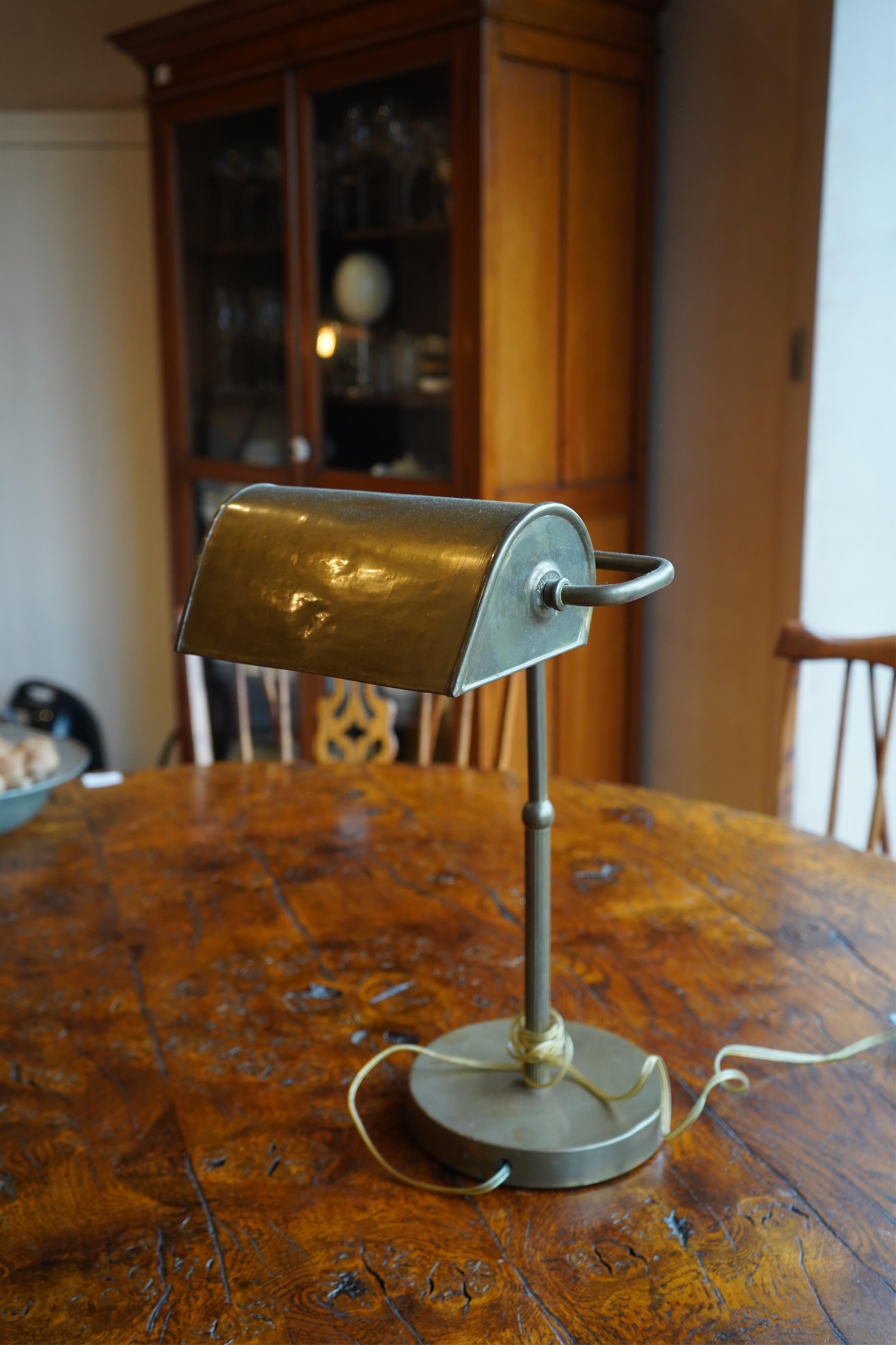 A 1920’s bankers desk lamp, 43cm high. Condition - fair, untested